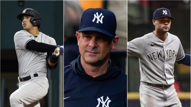 New York Yankees manager Aaron Boone with shortstops Oswald Peraza, Isiah Kiner-Falefa